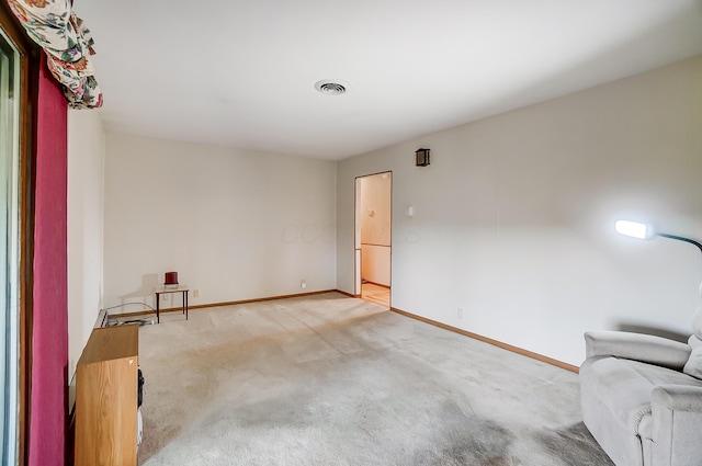 unfurnished living room featuring carpet