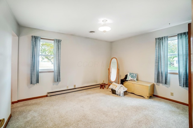 unfurnished room featuring carpet flooring and baseboard heating