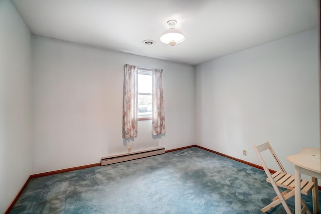 carpeted spare room featuring a baseboard radiator