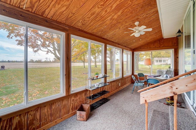 sunroom featuring lofted ceiling, wood ceiling, and ceiling fan