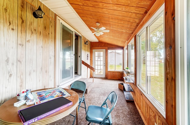 sunroom / solarium featuring wood ceiling, vaulted ceiling, and ceiling fan