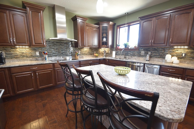 kitchen with black electric stovetop, dark hardwood / wood-style flooring, backsplash, wall chimney exhaust hood, and a kitchen island