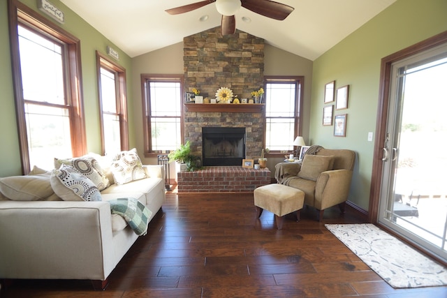 living room with dark hardwood / wood-style floors, a wealth of natural light, lofted ceiling, and ceiling fan