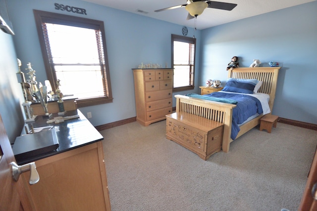 carpeted bedroom featuring ceiling fan