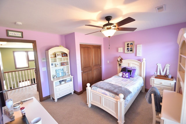 bedroom featuring carpet, a closet, and ceiling fan