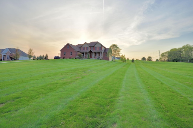 view of yard at dusk