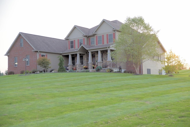 view of front of home featuring a porch and a front yard