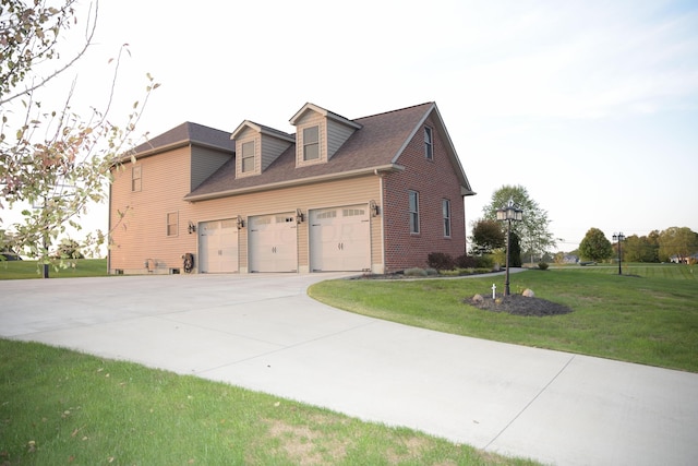 view of home's exterior with a lawn and a garage