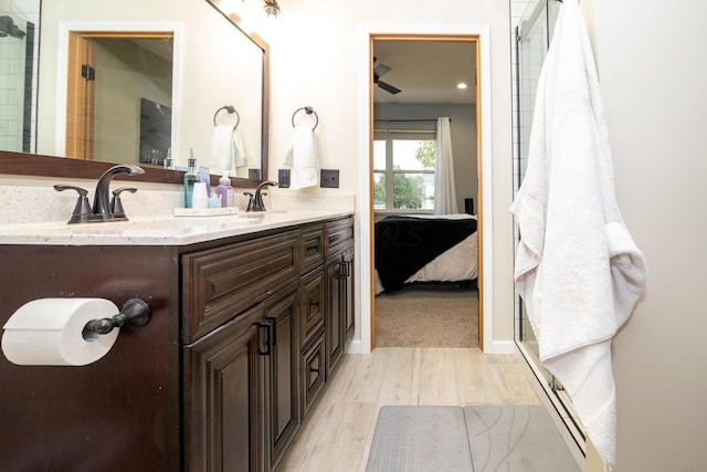 bathroom with vanity and hardwood / wood-style flooring