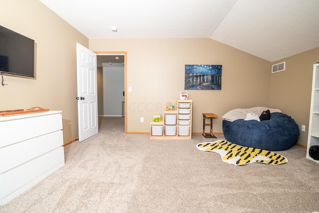 interior space with light carpet and lofted ceiling