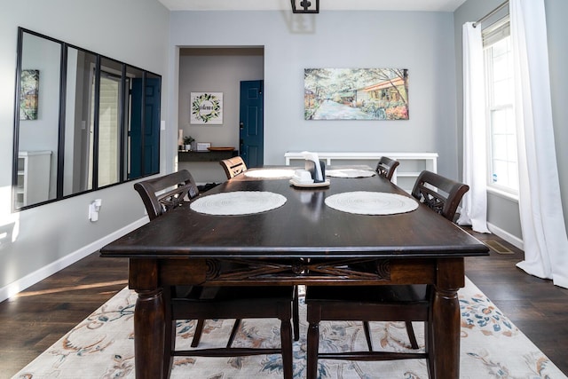 dining room featuring dark hardwood / wood-style flooring