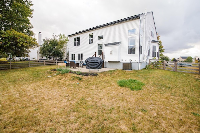 back of property featuring central AC unit, a patio area, and a lawn