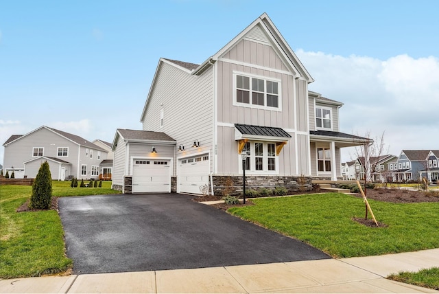 view of front of home featuring a garage and a front lawn