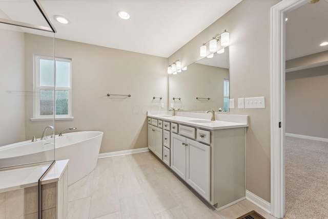 bathroom featuring a bathing tub and vanity