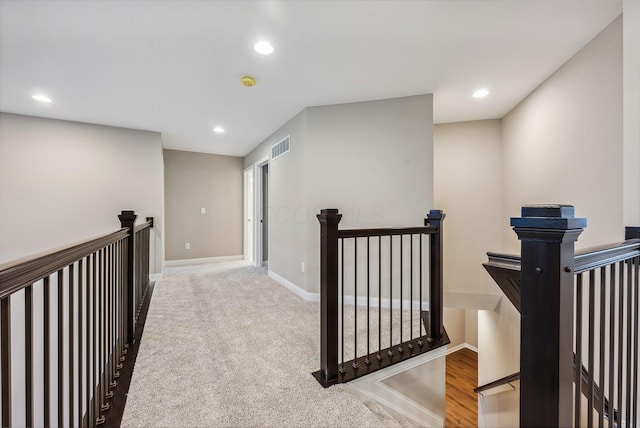 corridor featuring carpet flooring