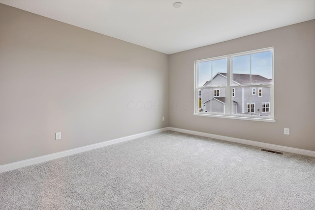 unfurnished room featuring carpet flooring