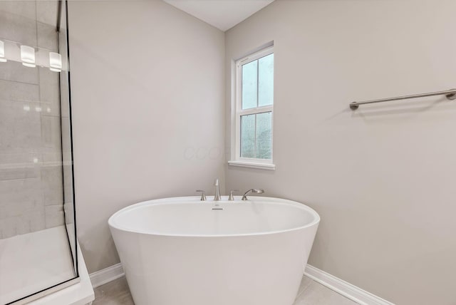 bathroom with tile patterned flooring and plus walk in shower