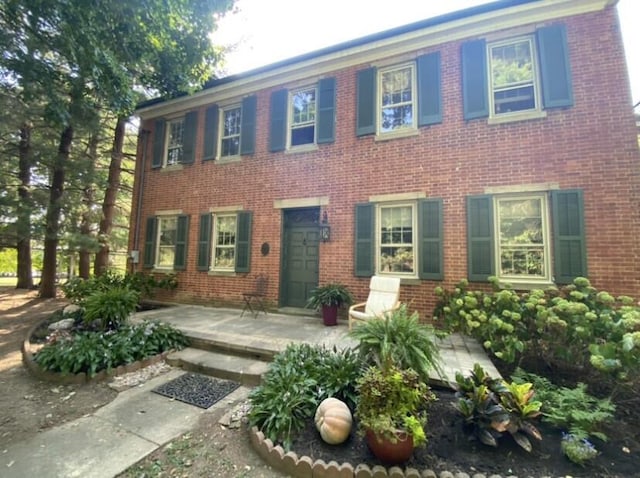 colonial house with a patio