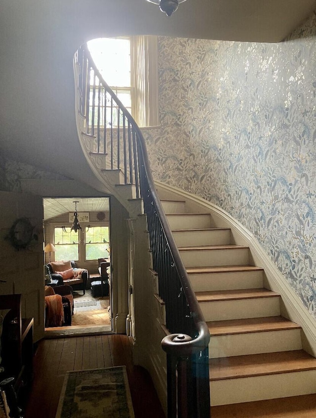 stairway featuring wood-type flooring