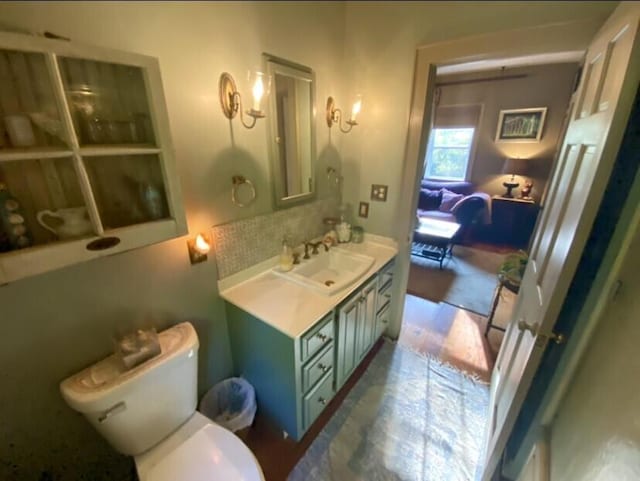 bathroom featuring hardwood / wood-style flooring, vanity, and toilet