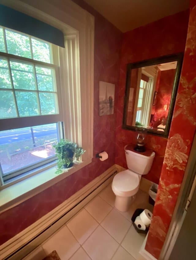 bathroom featuring tile patterned flooring and toilet