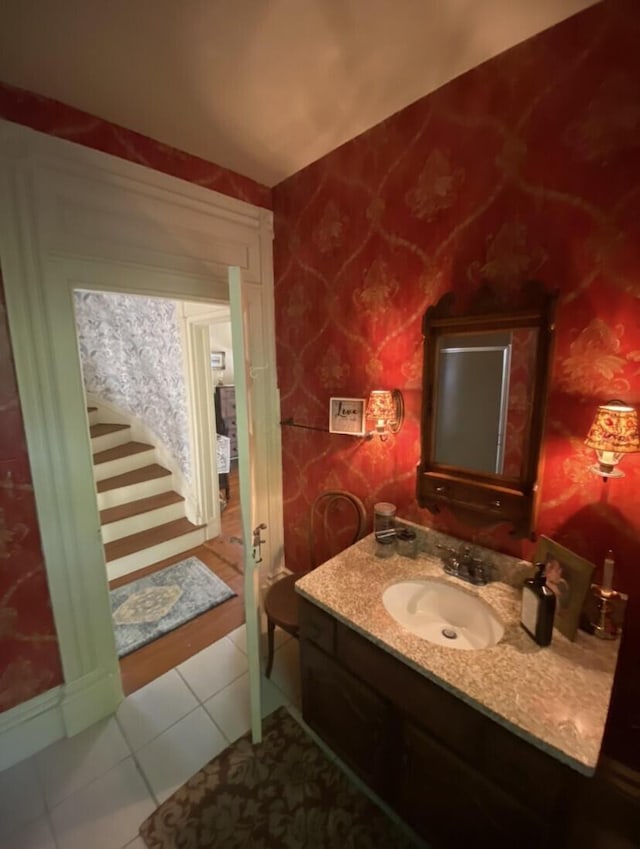 bathroom with tile patterned flooring and vanity