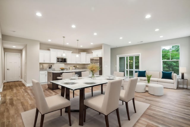 dining area with light hardwood / wood-style flooring