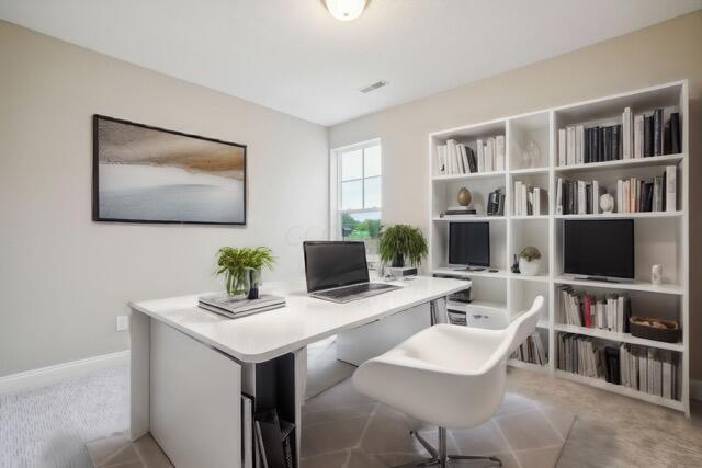 home office featuring light carpet