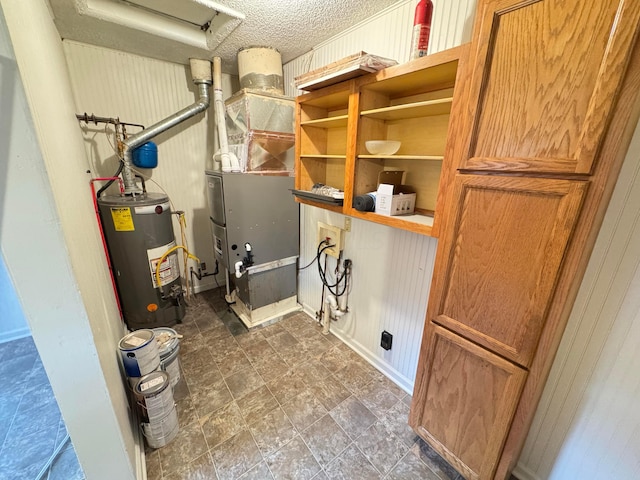 utilities featuring heating unit and gas water heater