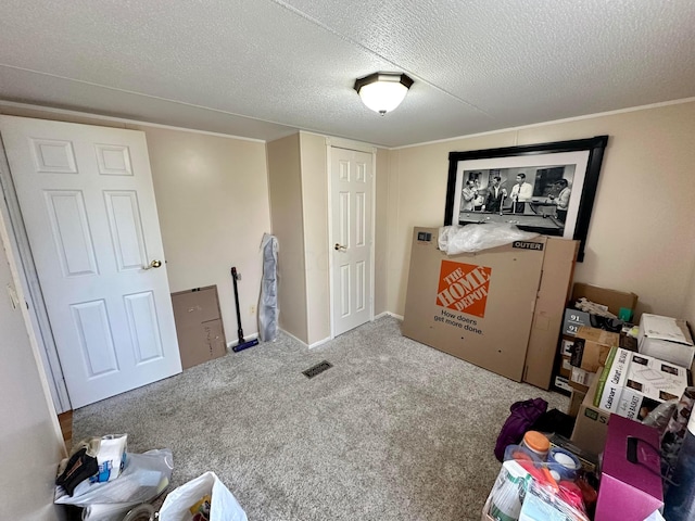 carpeted bedroom featuring a textured ceiling