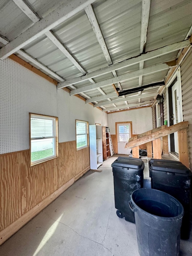 garage featuring wood walls