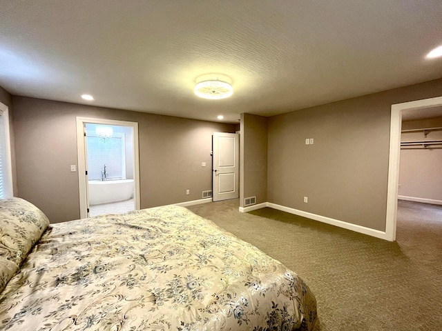 bedroom featuring carpet flooring and a textured ceiling