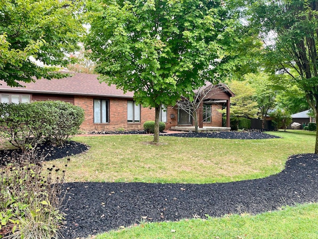 view of front of home with a front yard