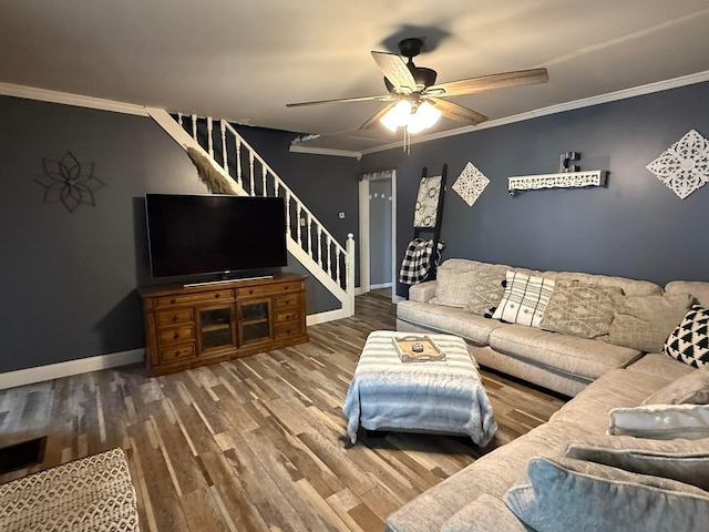 living room with hardwood / wood-style floors, ornamental molding, and ceiling fan