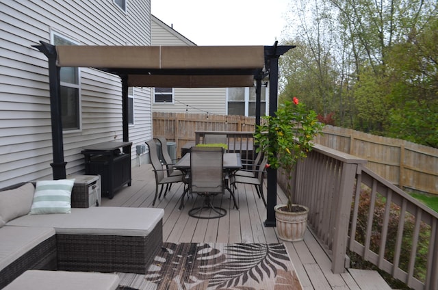 deck with fence and outdoor dining area