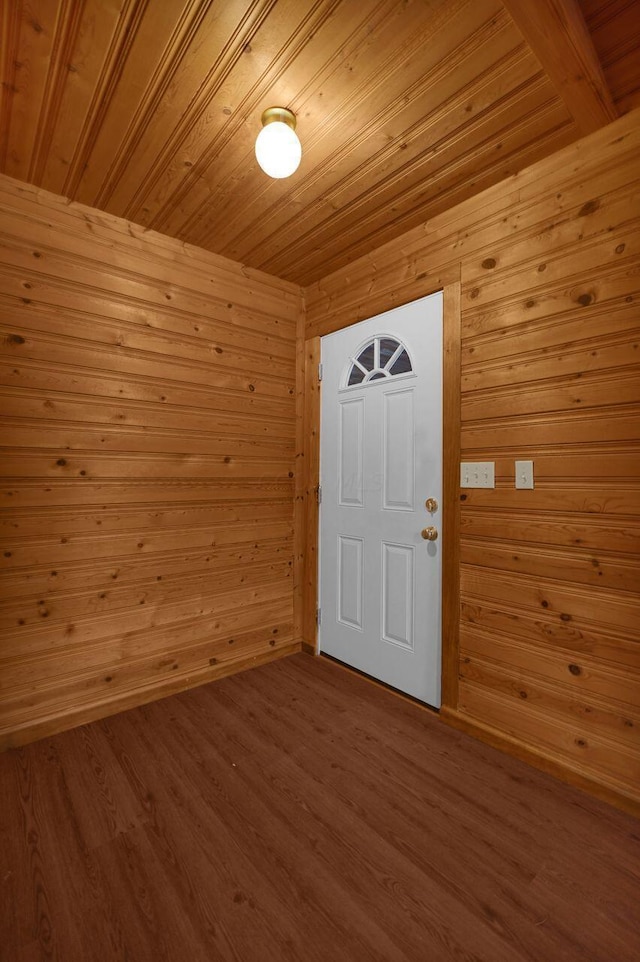 foyer with wood ceiling, wooden walls, and wood-type flooring