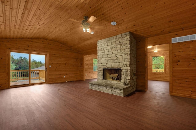 unfurnished living room featuring dark hardwood / wood-style floors, wood ceiling, and a wealth of natural light