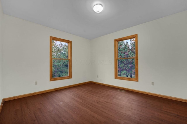 empty room featuring hardwood / wood-style floors