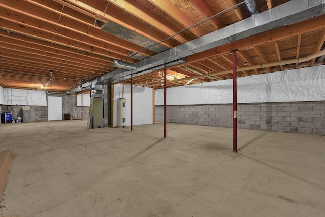 basement featuring heating unit and water heater