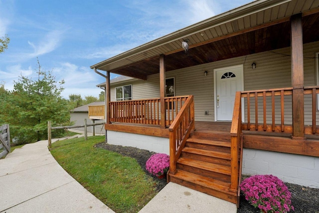 entrance to property featuring covered porch