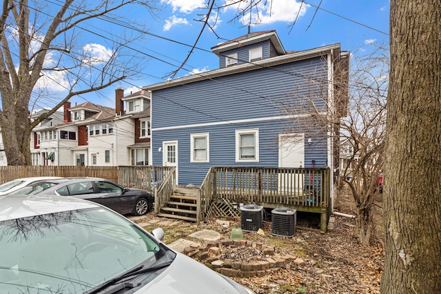 exterior space featuring a wooden deck and central AC unit