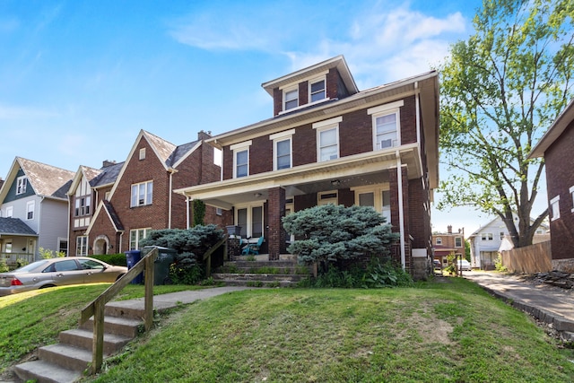 2395 Summit St, Columbus, OH 43202 - view of front of property with brick siding, a porch, a front yard, and a residential view