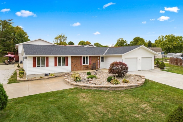 ranch-style house featuring a front yard and a garage