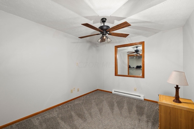 carpeted empty room featuring a textured ceiling and a baseboard heating unit