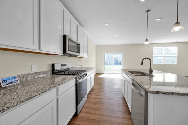 kitchen with white cabinetry, sink, plenty of natural light, and appliances with stainless steel finishes