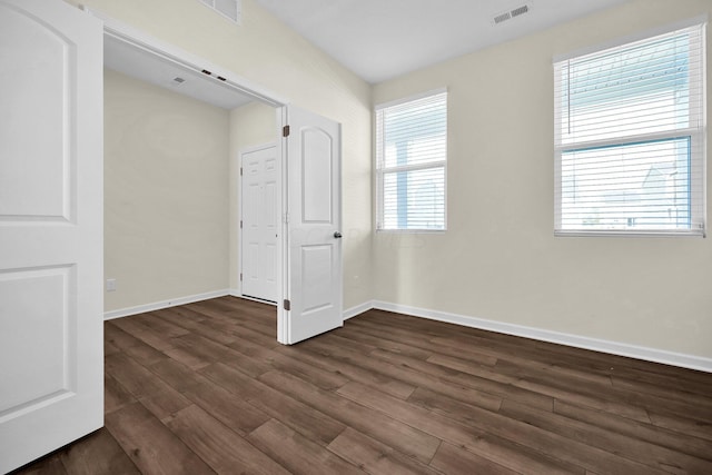 interior space with dark hardwood / wood-style flooring