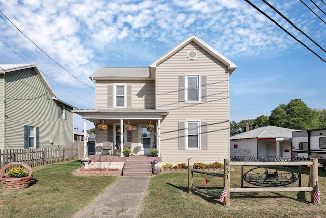 view of property with a porch and a front yard