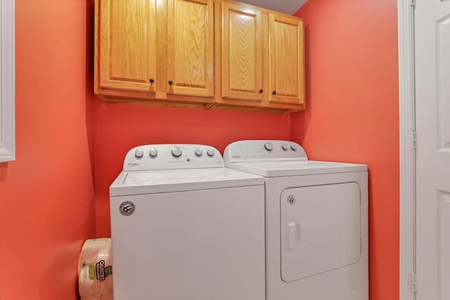 laundry area with cabinets and independent washer and dryer