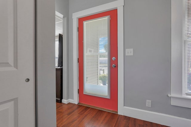 entryway with dark hardwood / wood-style floors