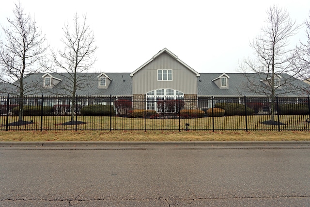 view of front of property with a fenced front yard and a front yard